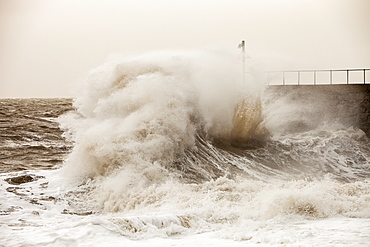 Gale force winds and crashing waves battering the coastal defences in Harrington, Workington, Cumbria, England, United Kingdom, Europe