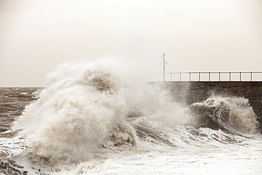 Gale force winds and crashing waves battering the coastal defences in Harrington, Workington, Cumbria, England, United Kingdom, Europe