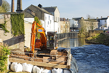 Constructing flood defences on the River Cocker in Cockermouth, Cumbria, England, United Kingdom, Europe