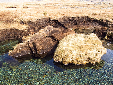 Huge chunks of peat eroded from the side of the Upper Esk by extreme flooding in the Lake District, Cumbria, England, United Kingdom, Europe