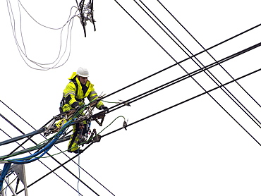 Technicians working to replace old insulators on a pylon in Barrow on Soar, Leicestershire, England, United Kingdom, Europe