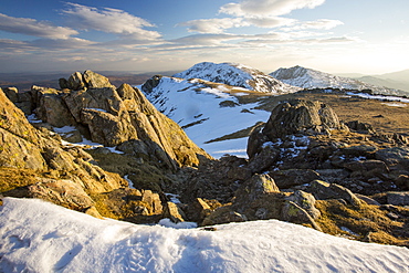 Lichen covered rocks on Swirl Howe above Wrynose, looking towards Dow Crag and Coniston Old Man, Lake District National Park, Cumbria, England, United Kingdom, Europe