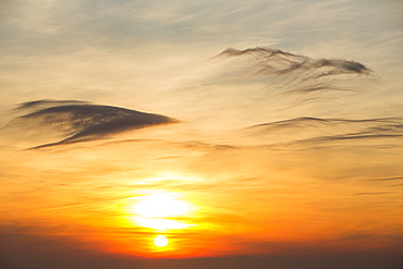 The sun setting over the Irish Sea from Hardknott Pass, in the Lake District, Cumbria, England, United Kingdom, Europe