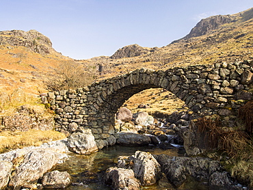 Lingcove Bridge, an ancient packhorse bridge over Lingcove Beck in the Upper Esk valley in Eskdale, Lake District, Cumbria, England, United Kingdom, Europe