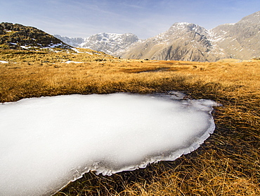 Scafell and Scafell Pike from the Upper Esk with a frozen tarn in the foreground, Lake District, Cumbria, England, United Kingdom, Europe