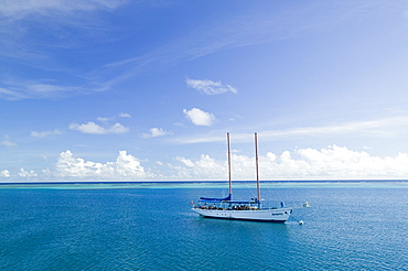 A sailing boat moored off the Mananucas Islands off Fiji, Pacific