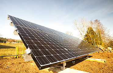 Solar panels fitted in an garden of a house in Gosforth, Eskdale, Cumbria, England, United Kingdom, Europe