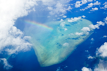 A rainbow over tropical reef near Tuvalu in the Pacific Ocean, Pacific