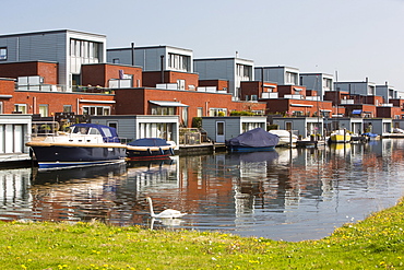 Houses in Almere next to canal, Flevoland, Netherlands, Europe