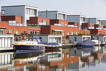 Houses in Almere next to canal, Flevoland, Netherlands, Europe