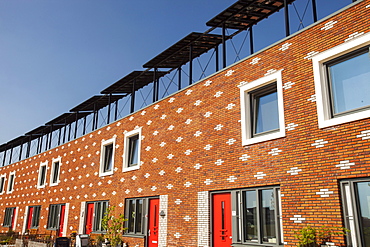 Houses in Almere with solar PV panels on the roof, Flevoland, Netherlands, Europe