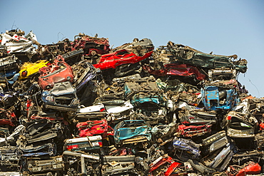 Old cars at a scrap metal merchants on the docks in Amsterdam, Netherlands, Europe