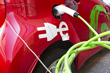 A Green wheels electric car at a charging station for electric cars in Amsterdam, Netherlands, Europe