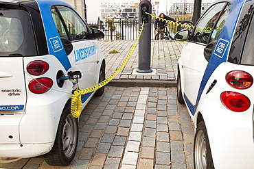 A Smart car at a charging station for electric cars in Ijburg, Amsterdam, Netherlands, Europe