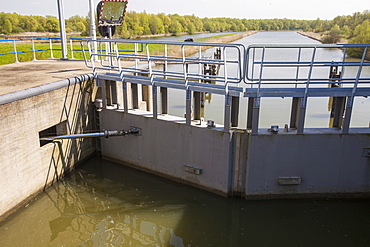 A canal going from the sea to the reclaimed polder land which is some 20 feet lower than the sea, north of Amsterdam, Netherlands, Europe