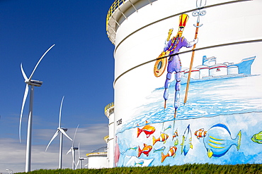 Climate change heaven and hell, an oil terminal with wind turbines, Amsterdam, Netherlands, Europe