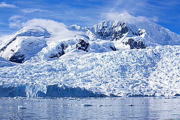 Stunning coastal scenery beneath Mount Walker in Paradise Bay off Graham Land on the Antarctic Peninsular. the Peninsular is one of the most rapidly warming places on the planet.