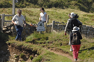 People walking on coast path, Deer Park, Marloes, Pembrokeshire, Wales, UK, Europe