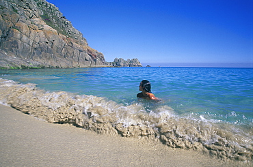 Swimming in sea. Porthcurno beach near the Minnack Theatre in West Cornwall      (rr)