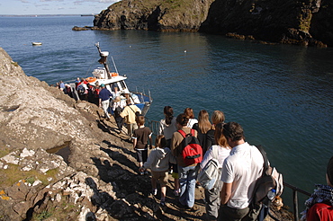 Tourists boarding the Dale Princess at Martins Haven, Martins Haven, Pembrokeshire, Wales, UK, Europe