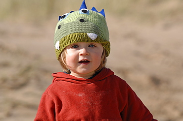 Young boy in sand dunes, Broad Haven South, Stackpole, Pembrokeshire, Wales, UK, Europe