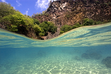 Sandy sea floor and cliff, Porco's Bay, Fernando de Noronha, UNESCO World Heritage Site, Brazil, South America