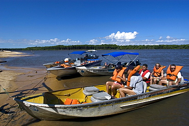 Tourists arriving at Pequenos Lencois Maranhenses after a boat ride through Preguicas river, Maranhao, Brazil, South America