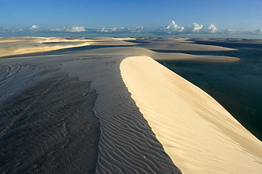 Sand dunes around Gaivota Lake at Lencois Maranhenses National Park, Santo Amaro, Maranhao, Brazil, South America