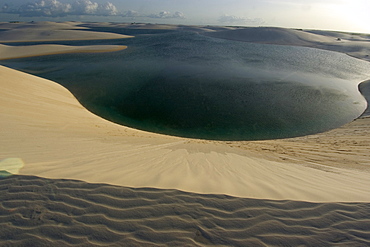 Sand dunes around Gaivota Lake at Lencois Maranhenses National Park, Santo Amaro, Maranhao, Brazil, South America