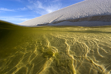 View from inside one of the lakes of Lencois Maranhenses National Park, Santo Amaro, Maranhao, Brazil, South America