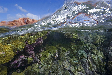 Split image of pristine coral reef and sky, Rongelap, Marshall Islands, Micronesia, Pacific