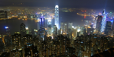 Hong Kong's modern skyline overlooking Victoria harbour and Kowloon peninsula at night, Hong Kong, China, Asia