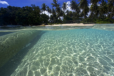 Split image of log, sandy bottom, and island, Truk lagoon, Chuuk, Federated States of Micronesia, Caroline Islands, Micronesia, Pacific Ocean, Pacific