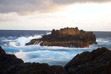 Wave crashing over South islet, St. Peter and St. Paul's rocks, Brazil, South America