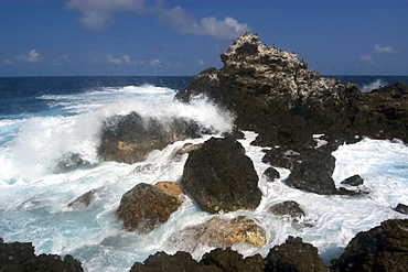 Wave crashing over rocks,  St. Peter and St. Paul's rocks, Brazil, South America