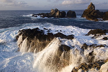 Wave crashing over rocks,  St. Peter and St. Paul's rocks, Brazil, South America