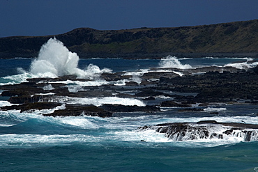 Waves crashing at Enseada da Caieira, Fernando de Noronha, Pernambuco, Brazil, South America