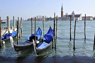 Gondolas parked in Venetian lagoon, with San Giorgio Maggiore Island in the background, Venice, UNESCO World Heritage Site, Veneto, Italy, Europe