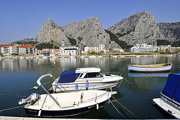 Boats, harbour and cliffs, coastal town of Omis, Croatia, Europe