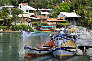 Boats and houses on canal, Fishing village of Barra da Lagoa, Florianopolis, Santa Catarina, Brazil, South America