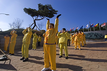 Falungong (Falun Dafa) demonstrators practising relaxation exercises, Geoje-Do, South Korea, Asia