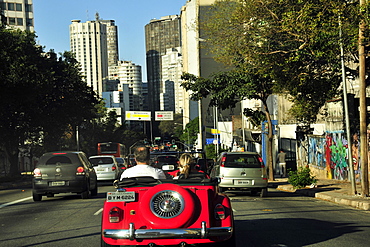 Red car on Consolacao Avenue, downtown Sao Paulo, Brazil, South America