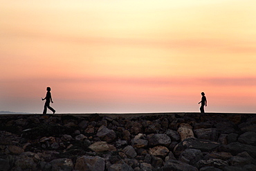 Break wall, beach front, sun set, afternoon, walk