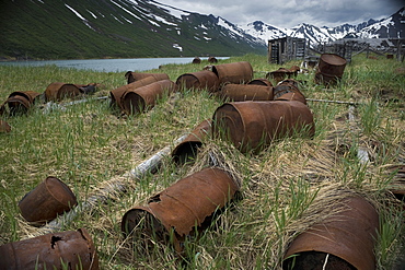 Abandoned Herring fishing settlement, tsunami damage, building debris, Landscape view of snow caped mountains, Yuzhnaya Glybokaya Bay (Bering Sea) Russia, Asia