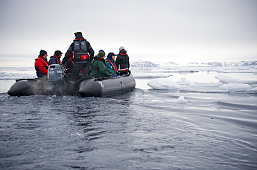 Zodiac, boat, cruise. tourists, arctic sheet ice. Longyearbyen, Svalbard, Norway