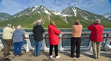 Views from the Clipper Odyssey towards Russkaya Bay of volcanic mountains in mist and sun set, Russkaya Bay (Bering Sea), Russia, Asia.