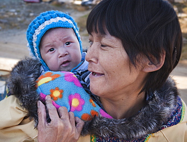 Inuit Mother and baby. Kimmirut, Baffin Island (Qikiqtaaluk) Nunavut, Canada, North America