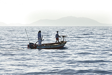 Whale hunters. Note the typically small boat and home made harpoon- an adapted rifle. Eastern Caribbean