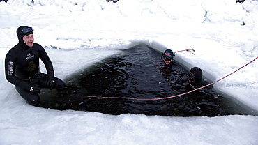 Freediving under the ice in Northern Russia in the White Sea. White Sea, Russia