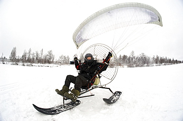 Olof Heikka a sami reindeer herdsman  on his paramotor